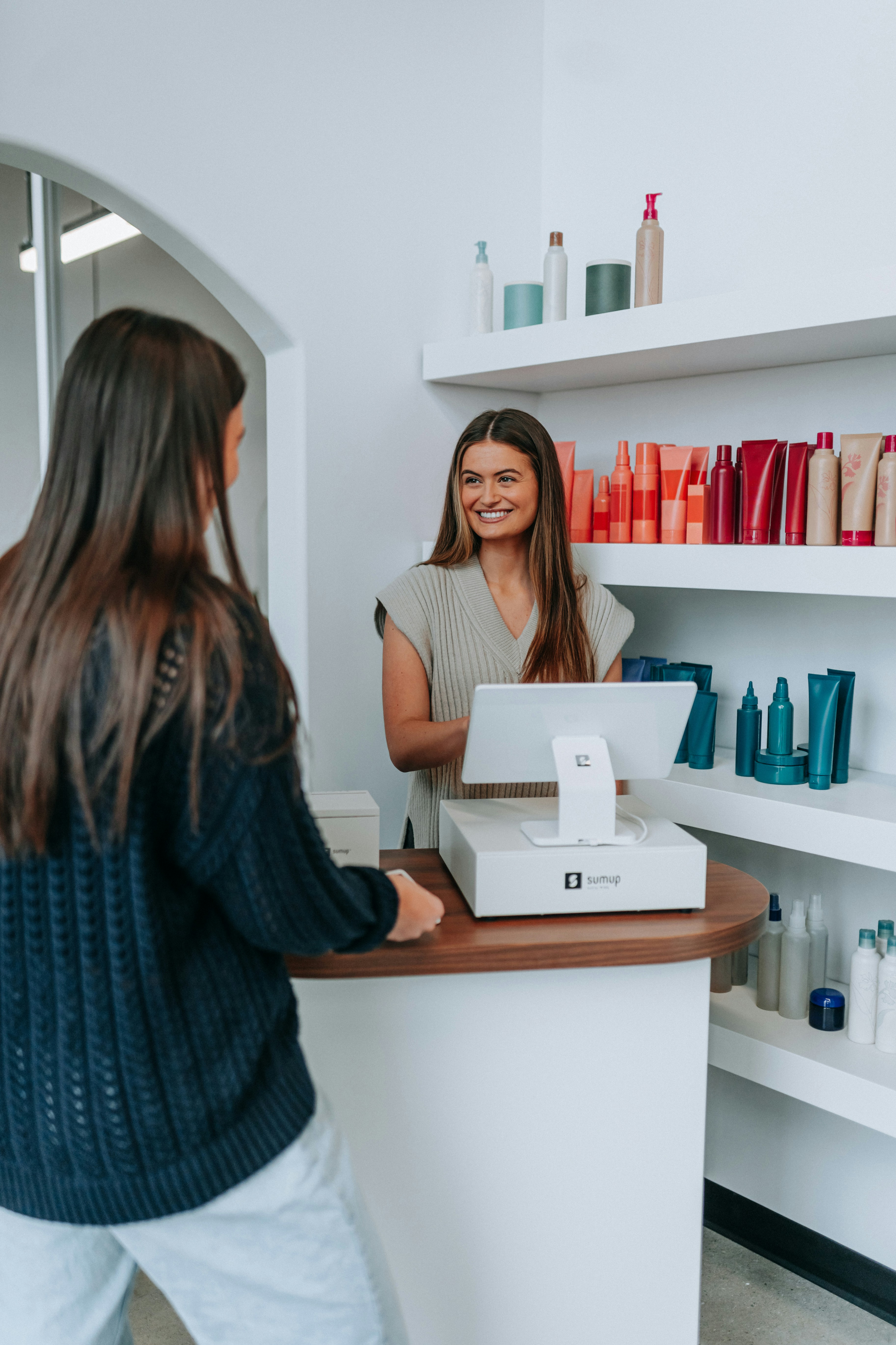 Retail checkout counter with employee